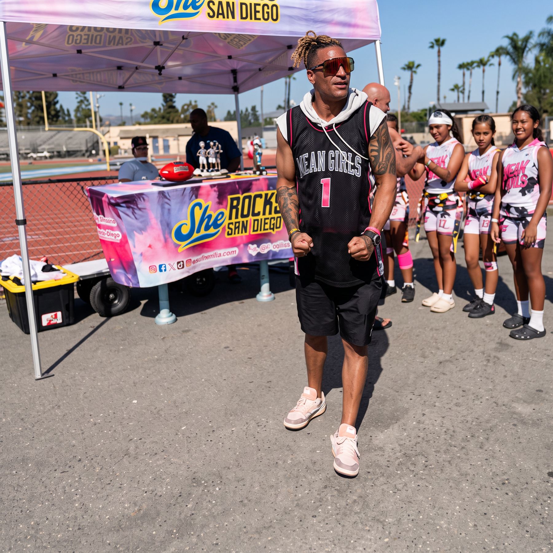 Coach Jason walking the sideline with his team at a She Rocks San Diego event